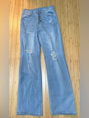 Distressed light wash button fly jeans. Size XS. Flair leg.